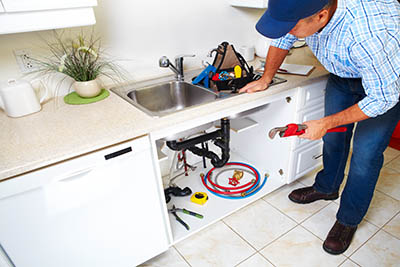 plumbing-home-installation-plumber-fixing-kitchen-appliance.jpg
