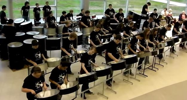 THE LION SLEEPS TONIGHT Dover High School students and members of the steel drum band performed this classic in the lobby of the Performing Arts Center at Kent State University Tuscarawas under the direction of Joan Wenzel. IN FLYERMALL BY SPYROS PETER GOUDAS