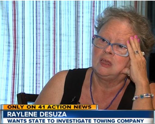 Woman taking action after receiving towing bill