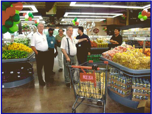 NATIONS FOODS VAUGHAN IMAGES, SPYROS PETER GOUDAS WITH NATIONS OWNER TOM AND ASSOCIATES PREPARING FOR THE OPENING OF THE WOODBRIDGE LOCATION. FLYERMALL.COM THE MOST WATCHED WEBSITE ADVERTISING SITE WORLDWIDE.